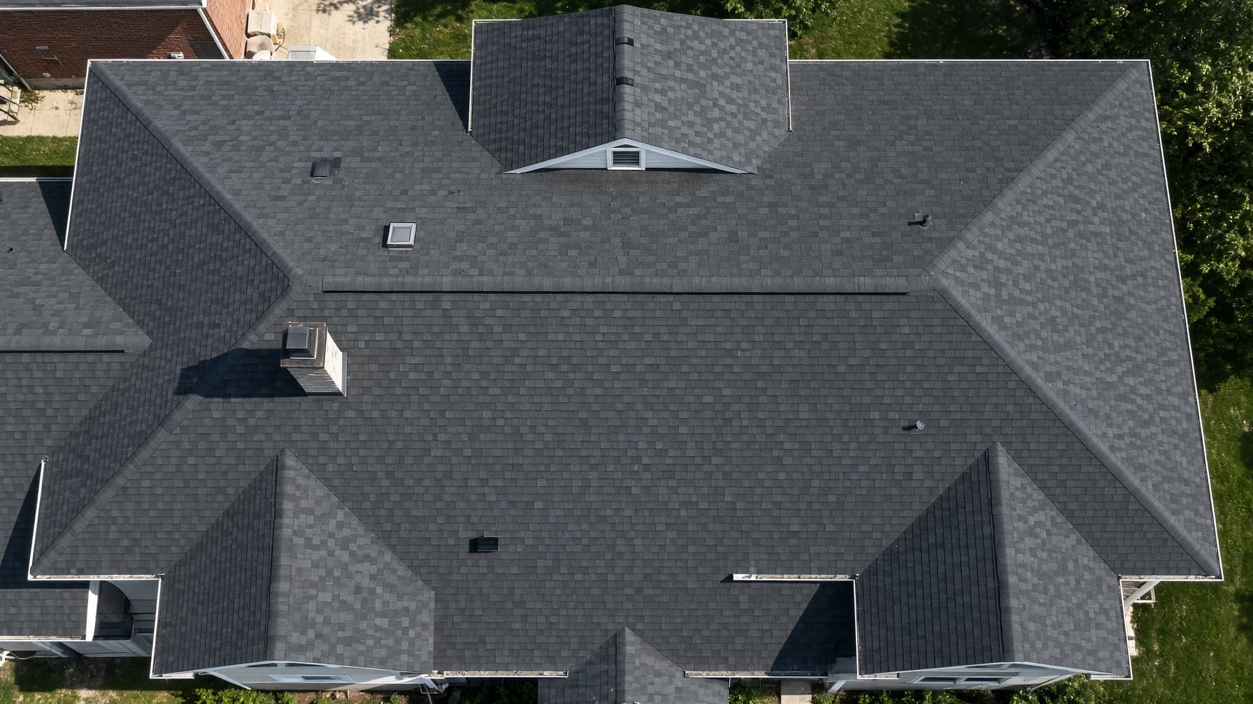Straight-down aerial of a residential asphalt shingle roof